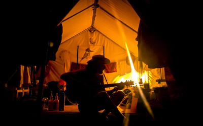 Graduate student Zac chills with some guitar tunes at his campsite in Ontario (Photo: Zac MacDonald)